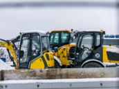 Construction vehicles parked in the snow